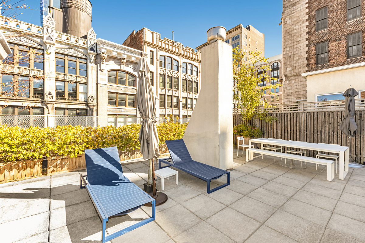 42 East 20th Street, Unit 4AD Manhattan, NY 10003 - Photo 17 of 19 a view of a building with a bench
