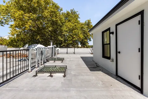 a view of balcony with small garden