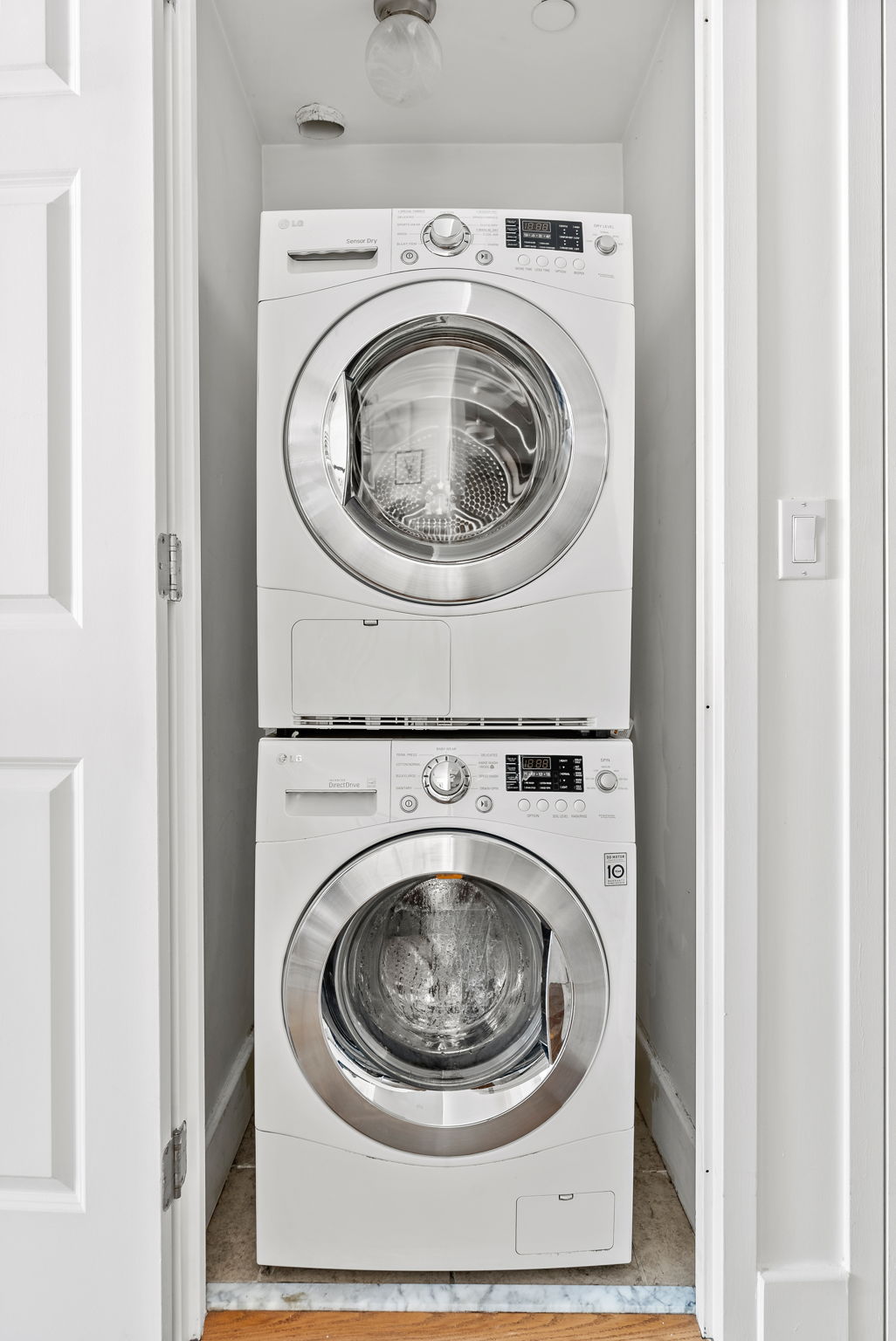 106 West 116th Street, Unit 2A Manhattan, NY 10026 - Photo 5 of 16 a utility room with dryer and washer