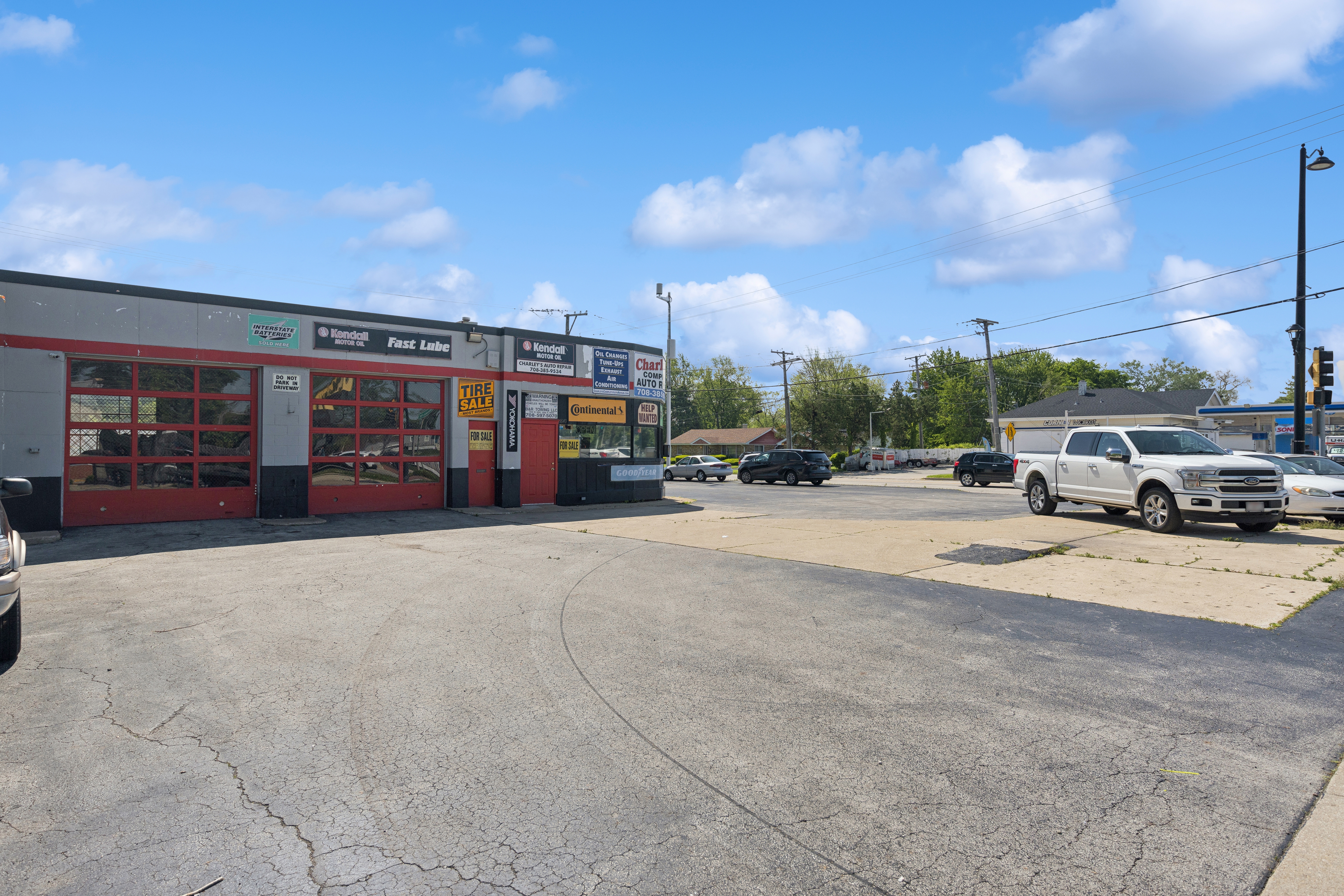 11849 South Pulaski Road Alsip, IL 60803 - Photo 6 of 20 a view of road with card parked on side and retail shops