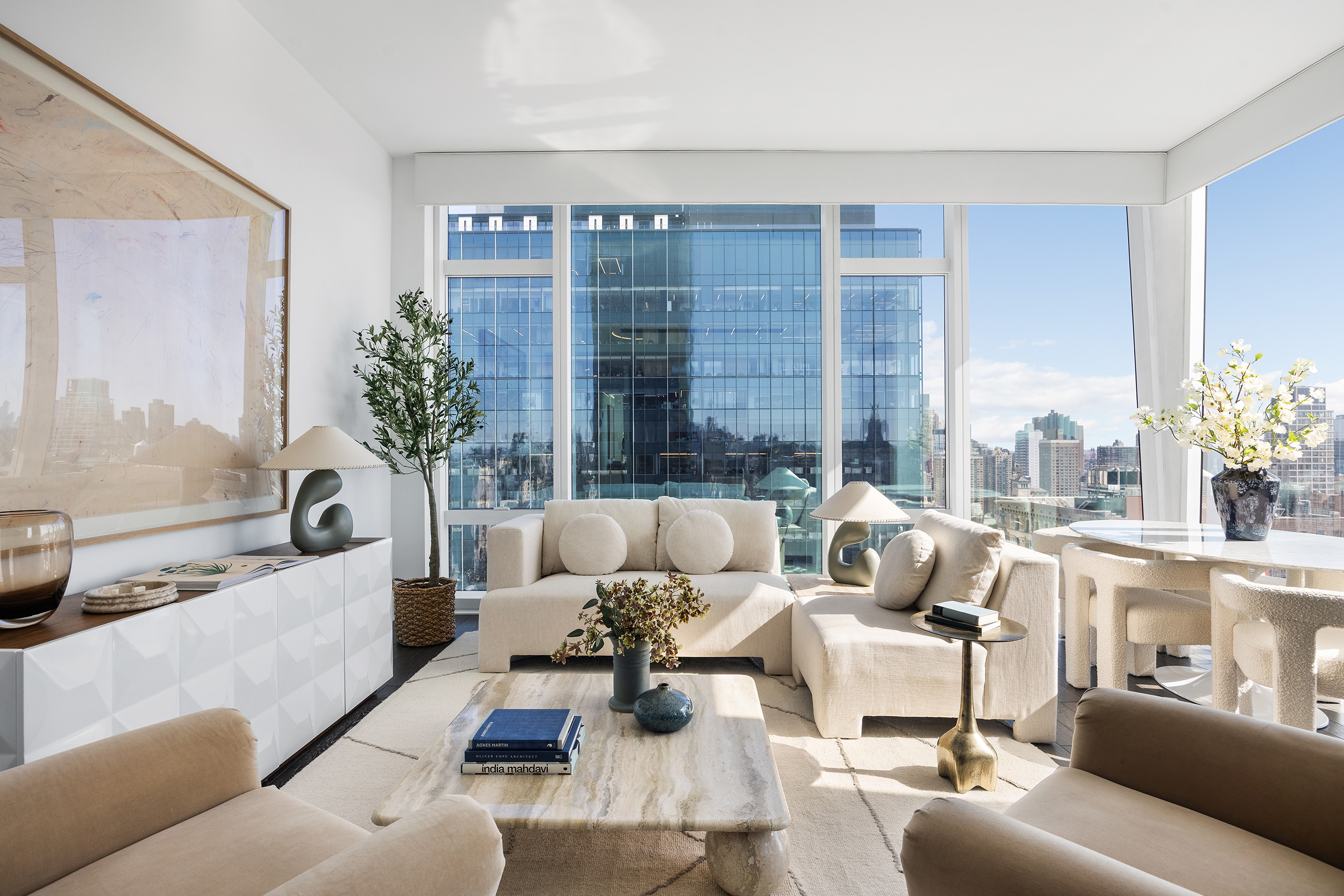 45 East 22nd Street, Unit 32B Manhattan, NY 10010 - Photo 3 of 36 a living room with furniture and a large window