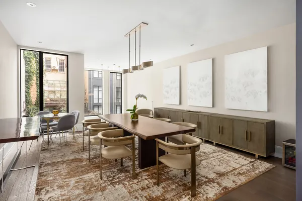 a living room filled with furniture and a chandelier