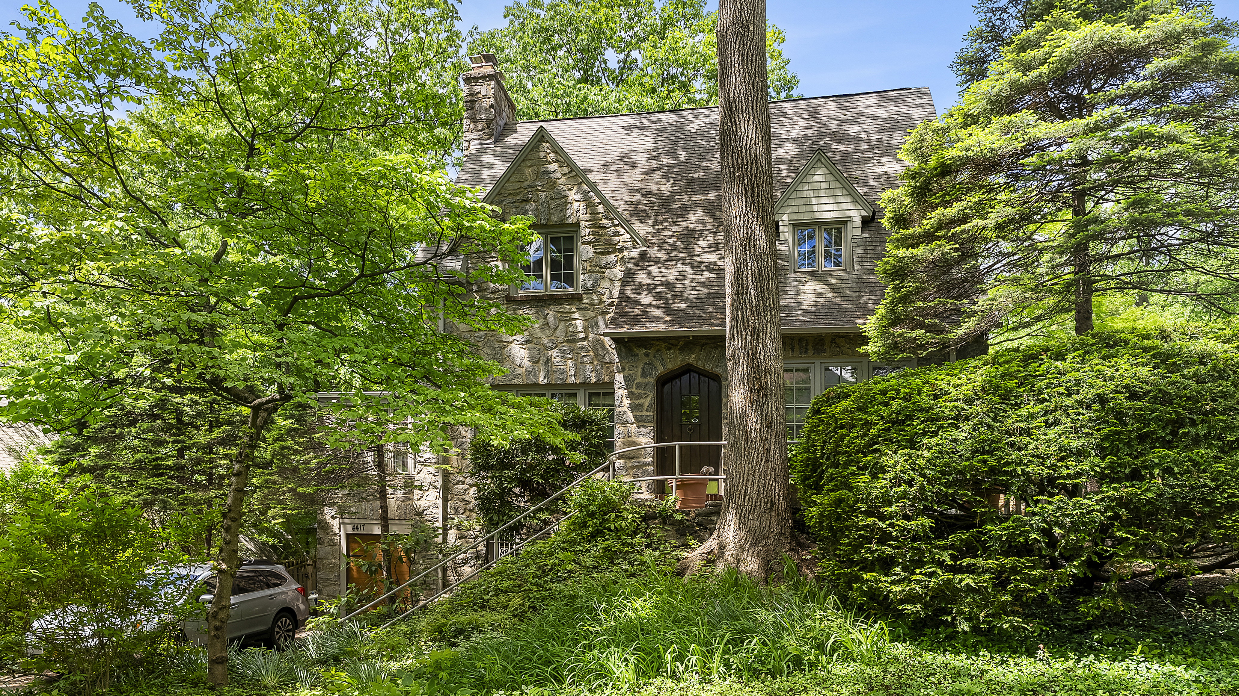 an aerial view of a house with plants and garden