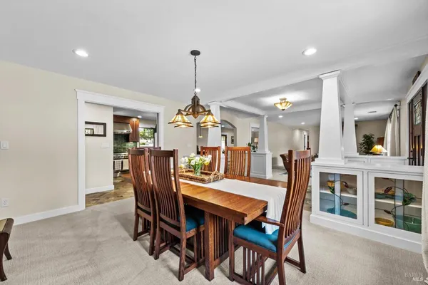 a kitchen with granite countertop a sink and a stove