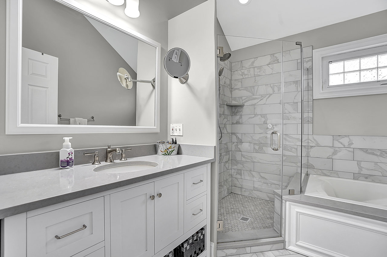 266 Feronia Way Rutherford, NJ 07070 - Photo 21 of 41 a bathroom with a granite countertop sink a toilet and shower