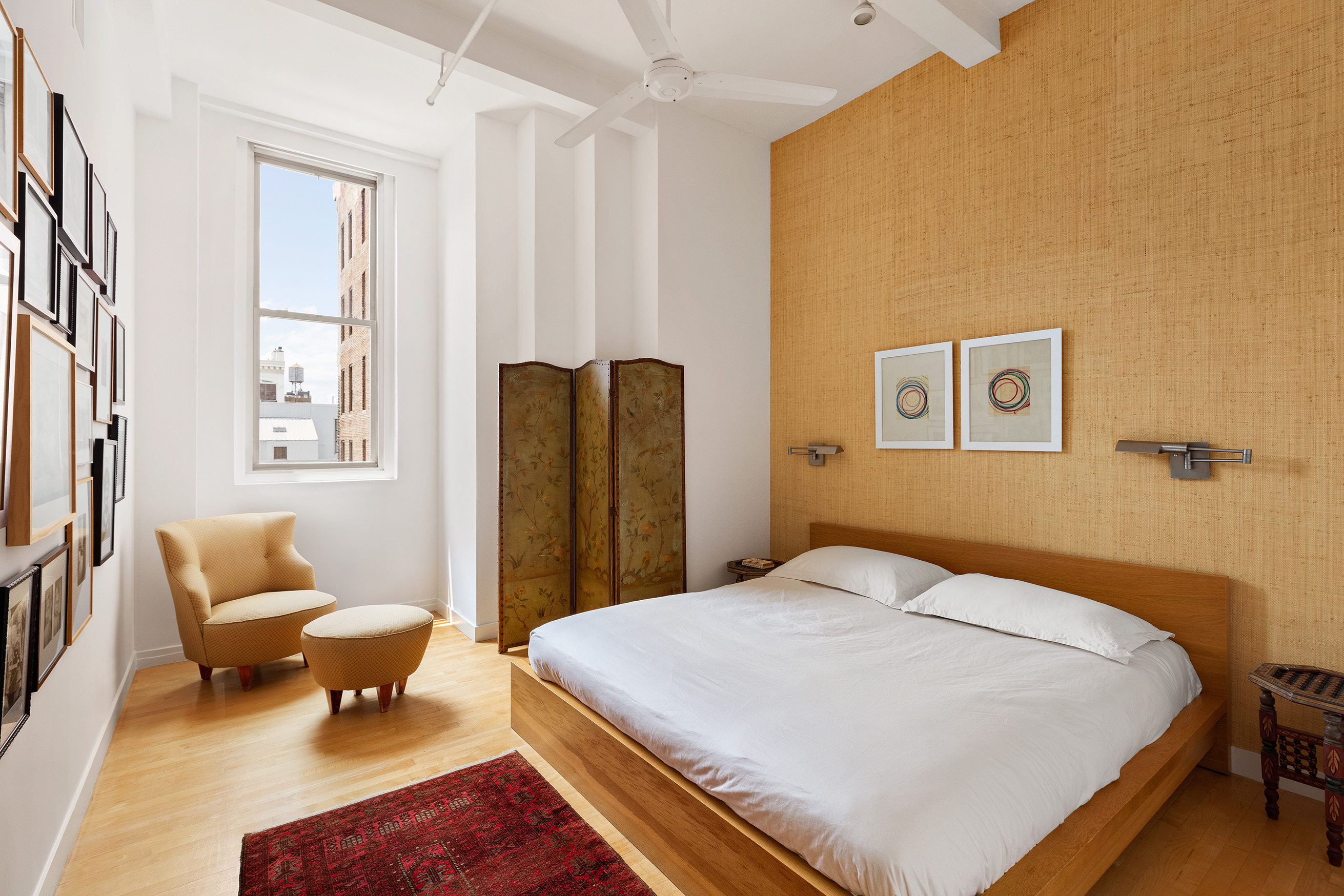 32 West 20th Street, Unit 9B Manhattan, NY 10011 - Photo 7 of 16 a bedroom with a bed and chair