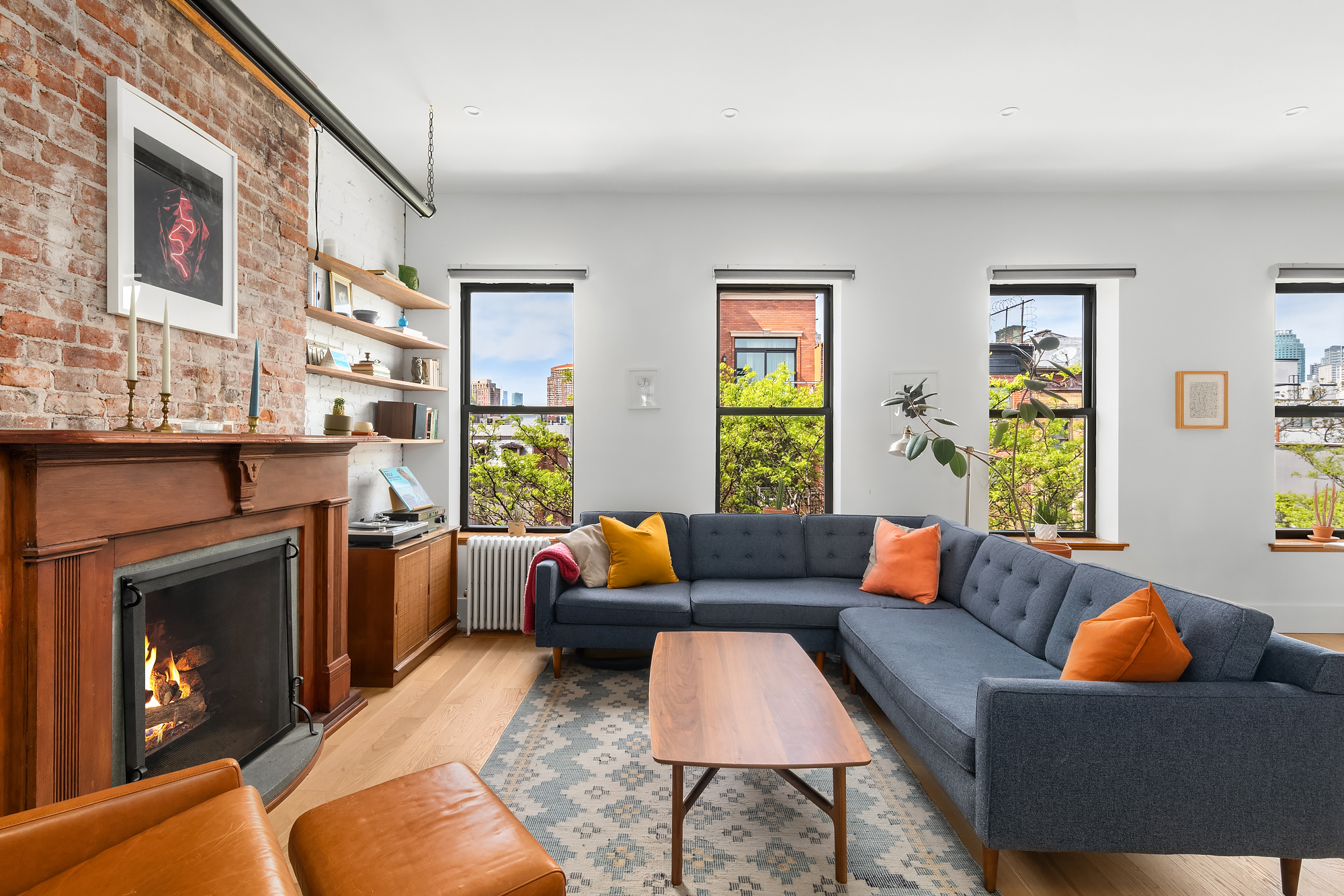 a living room with furniture and a fireplace