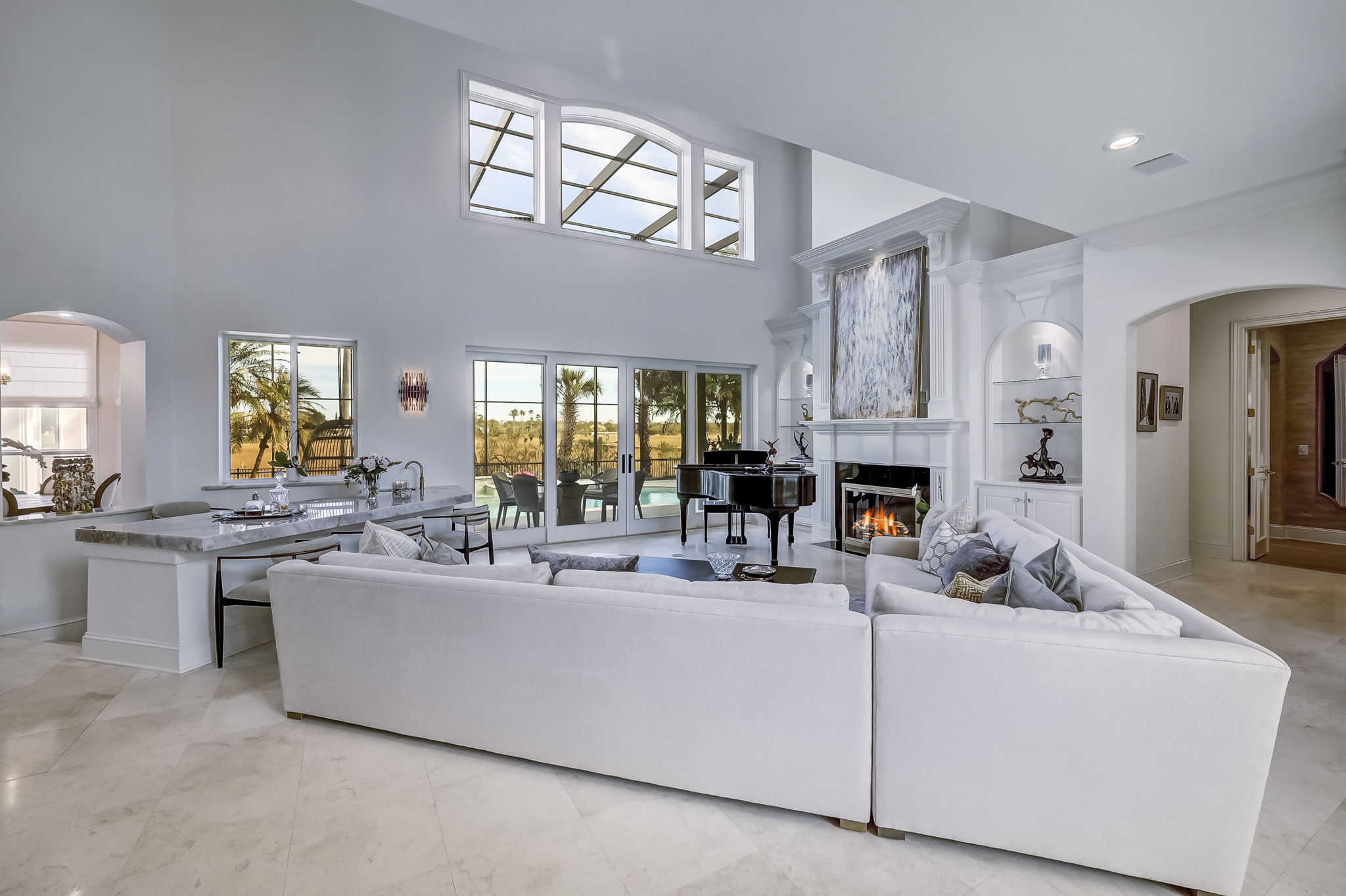 24624 Harbour View Drive Ponte Vedra Beach, FL 32082 - Photo 27 of 186 a living room with furniture a fireplace and a large mirror