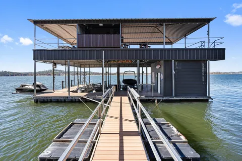 an aerial view of a house with a lake view