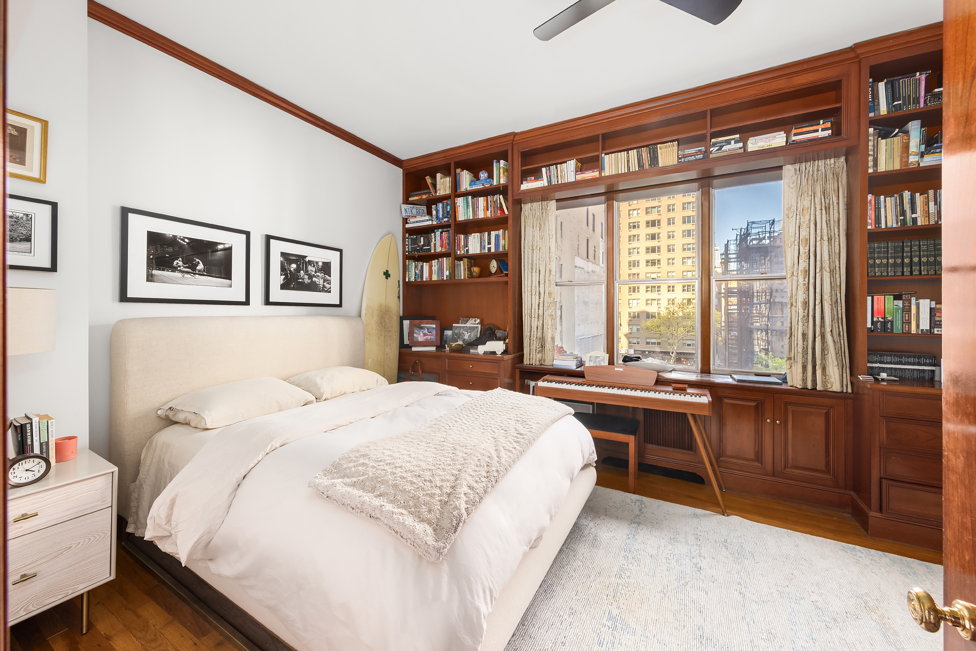159 West 13th Street Manhattan, NY 10011 - Photo 34 of 36 a spacious bedroom with a large bed and a window