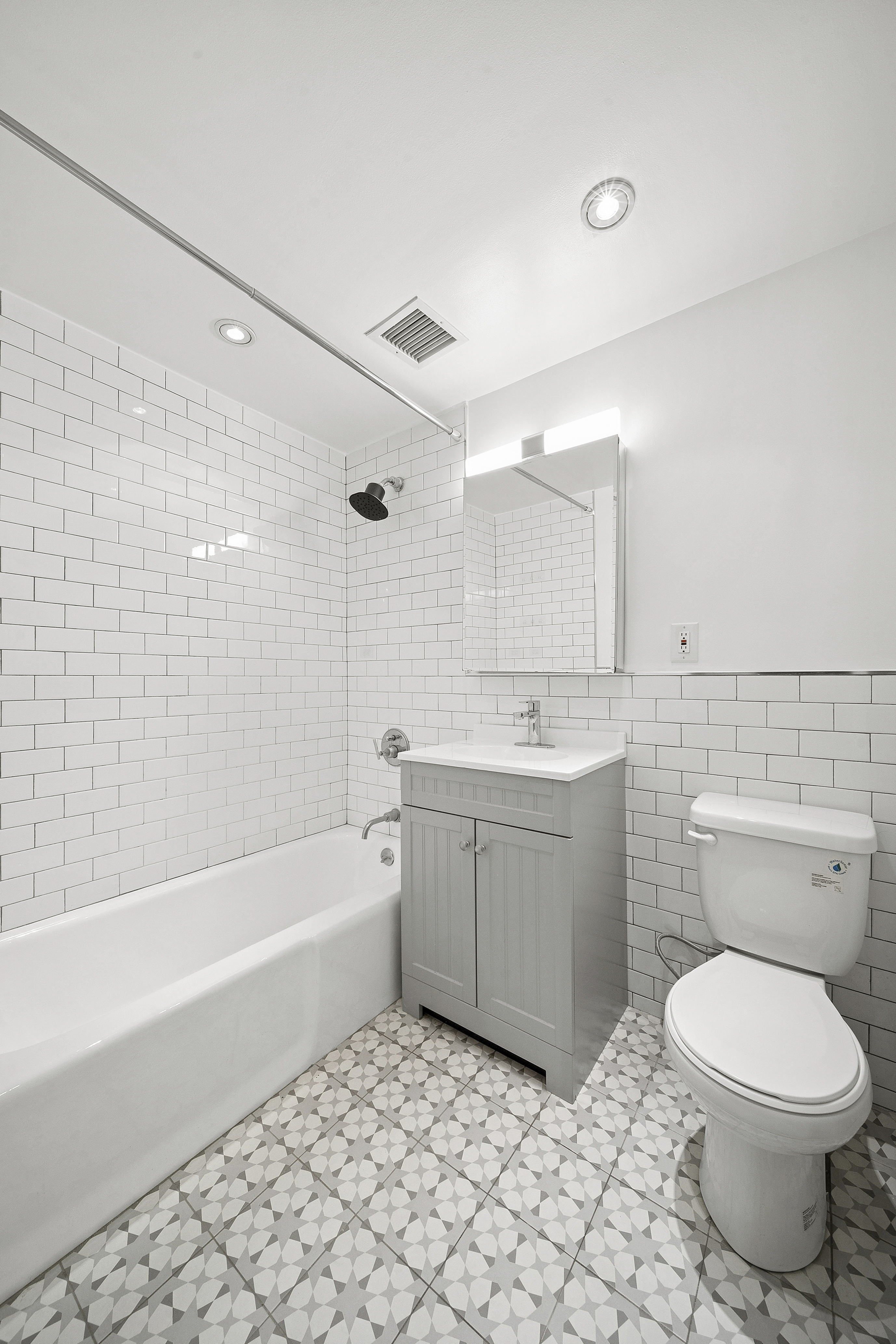 525 East 11th Street, Unit 4D Manhattan, NY 10009 - Photo 5 of 10 a bathroom with a sink a toilet and bathtub