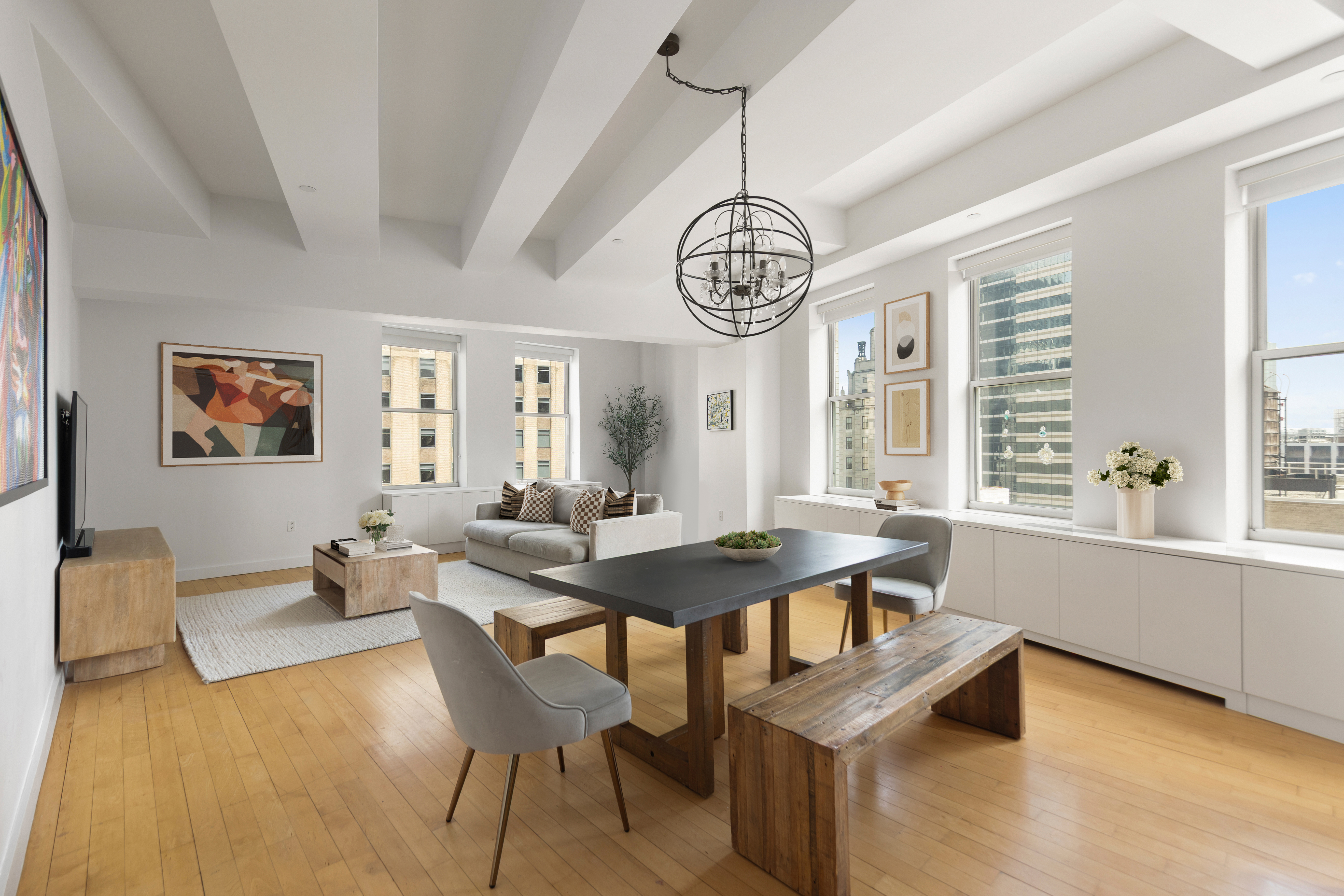 15 Broad Street, Unit 3100 Manhattan, NY 10005 - Photo 1 of 27 a view of a dining room with furniture window and wooden floor