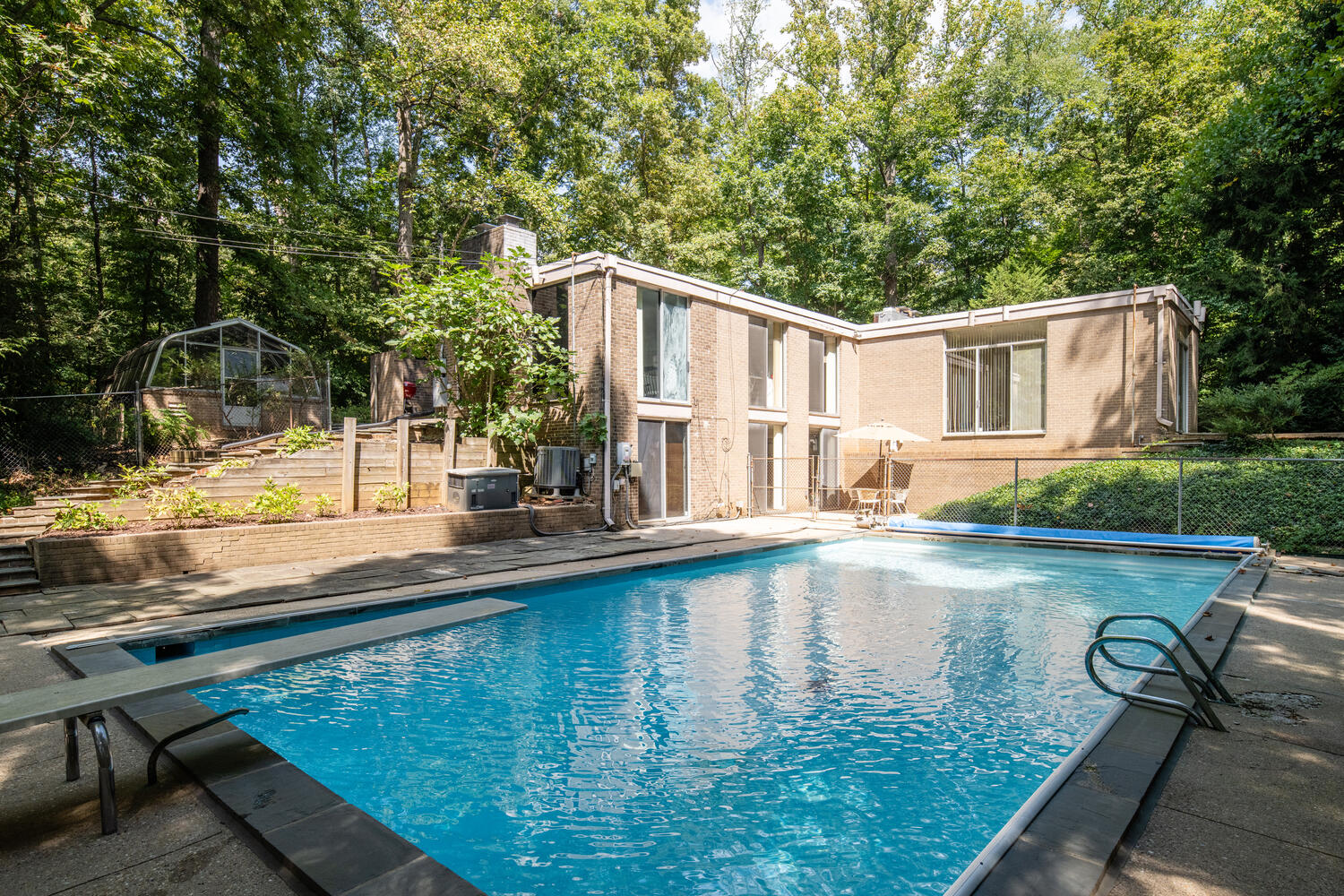 7101 Crail Drive Bethesda, MD 20817 - Photo 14 of 15 a view of a swimming pool with a patio