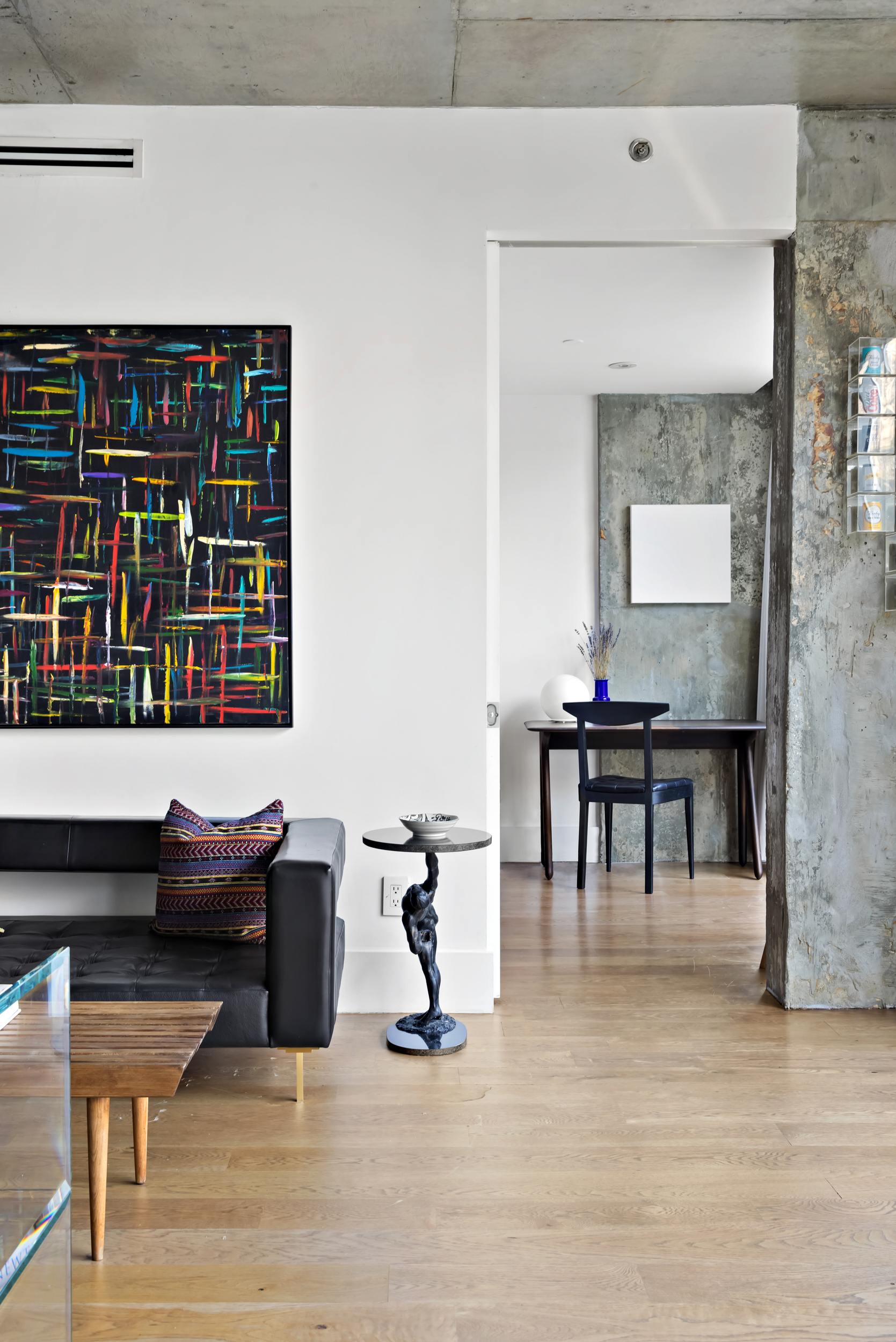 115 Norfolk Street, Unit 304 Manhattan, NY 10002 - Photo 7 of 15 a living room with furniture and a dining table