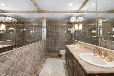 a bathroom with a sink and mirror