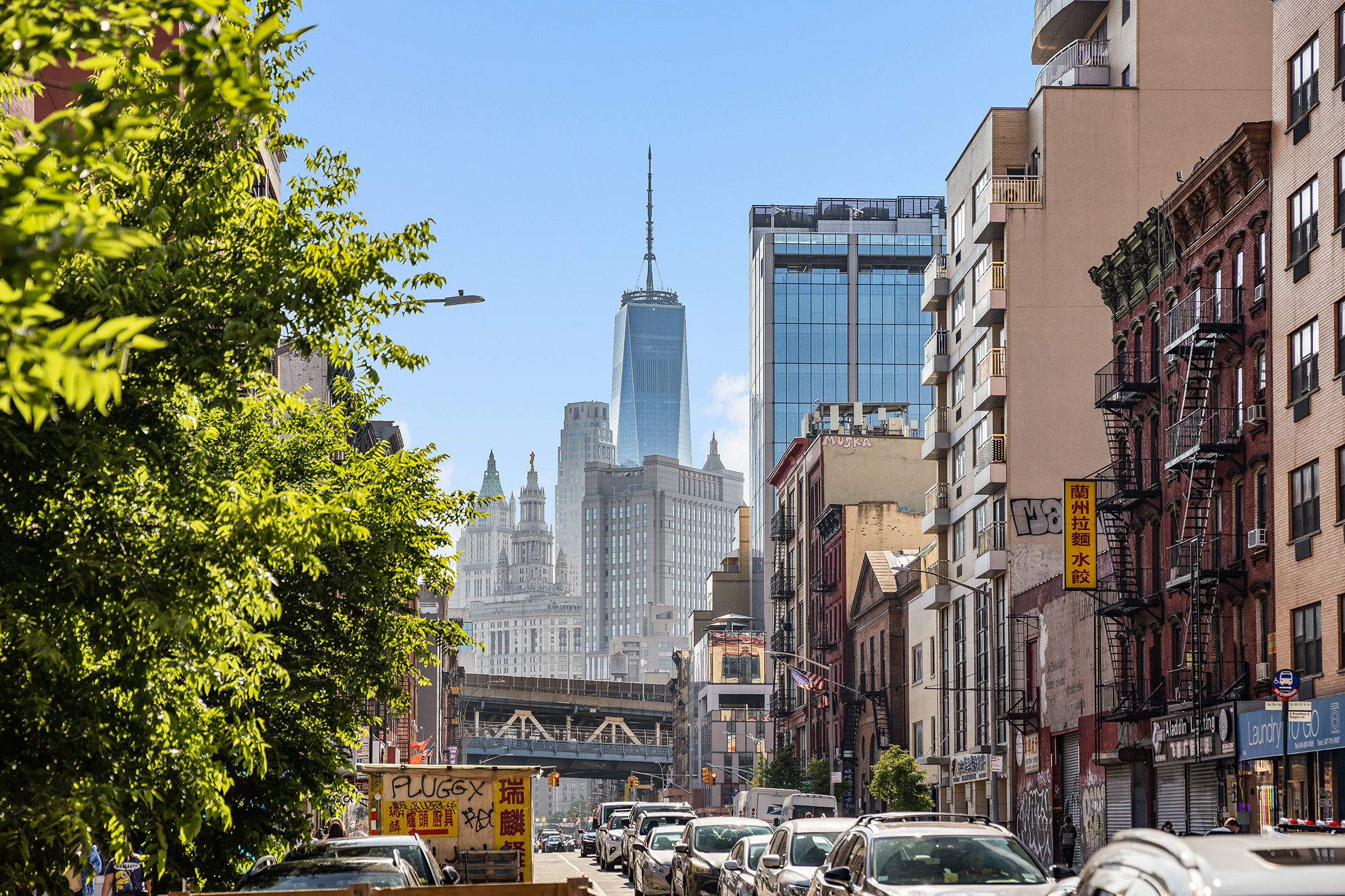 175 East Broadway, Unit 6A Manhattan, NY 10002 - Photo 7 of 11 a city street lined with buildings and cars