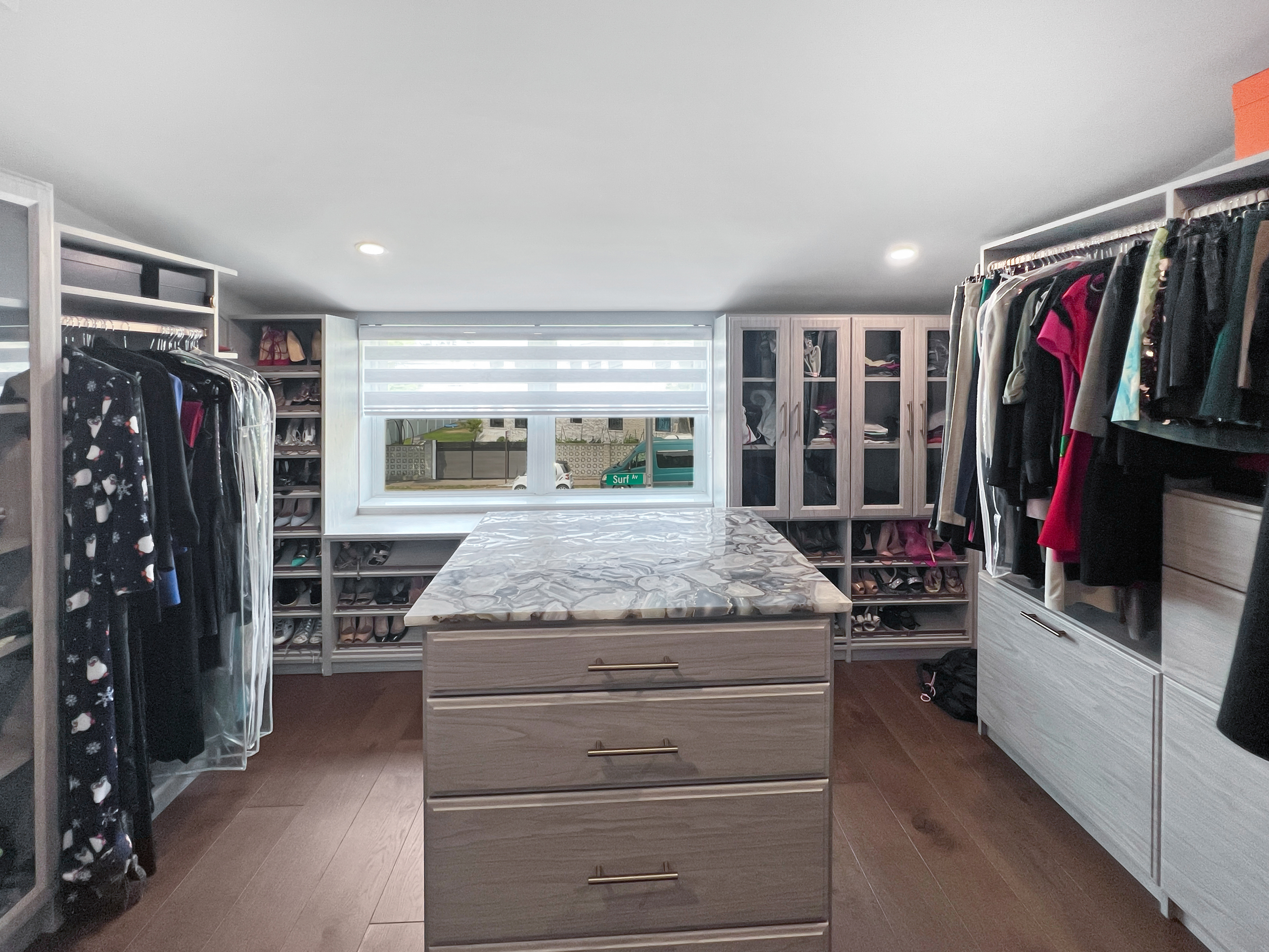 5021 Surf Avenue Brooklyn, NY 11224 - Photo 12 of 32 a view of a walk in closet with clothes and shoes