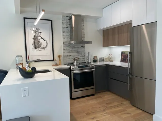 a kitchen with a sink and a refrigerator