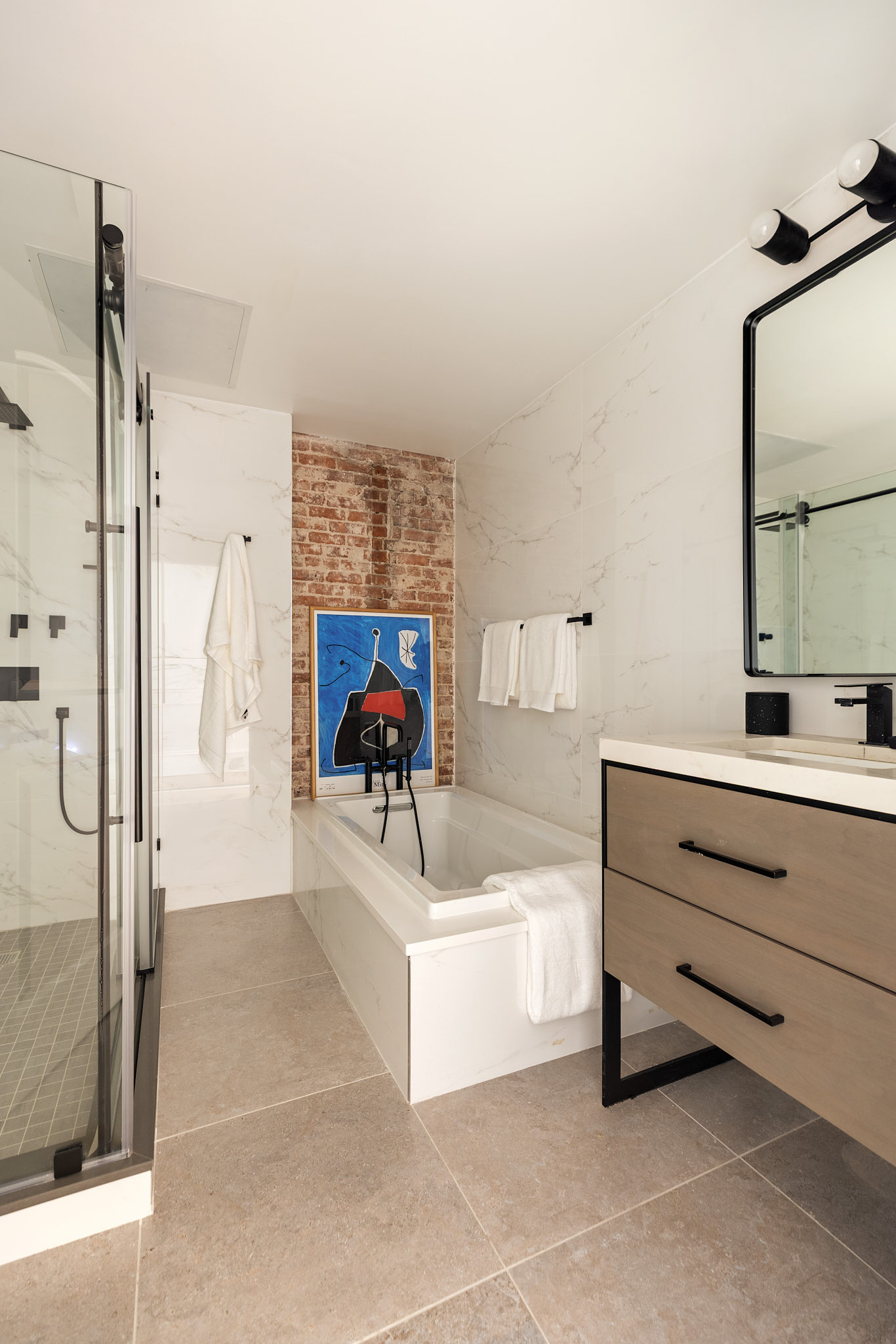 143 Milton Street Brooklyn, NY 11222 - Photo 14 of 19 a bathroom with a tub sink and mirror