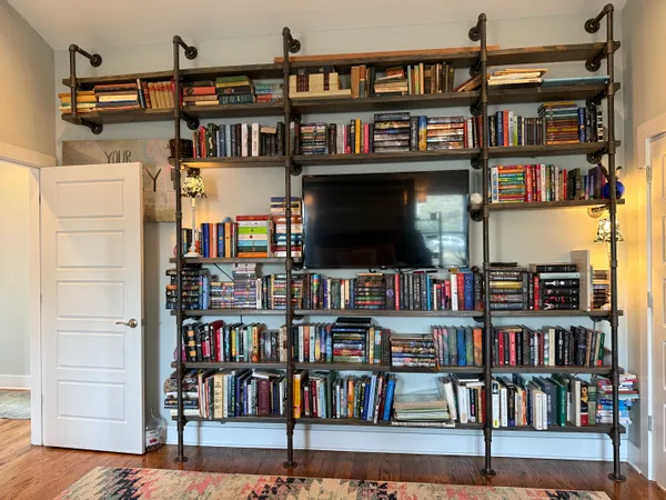 a bookshelf with wooden floor in a book shelf