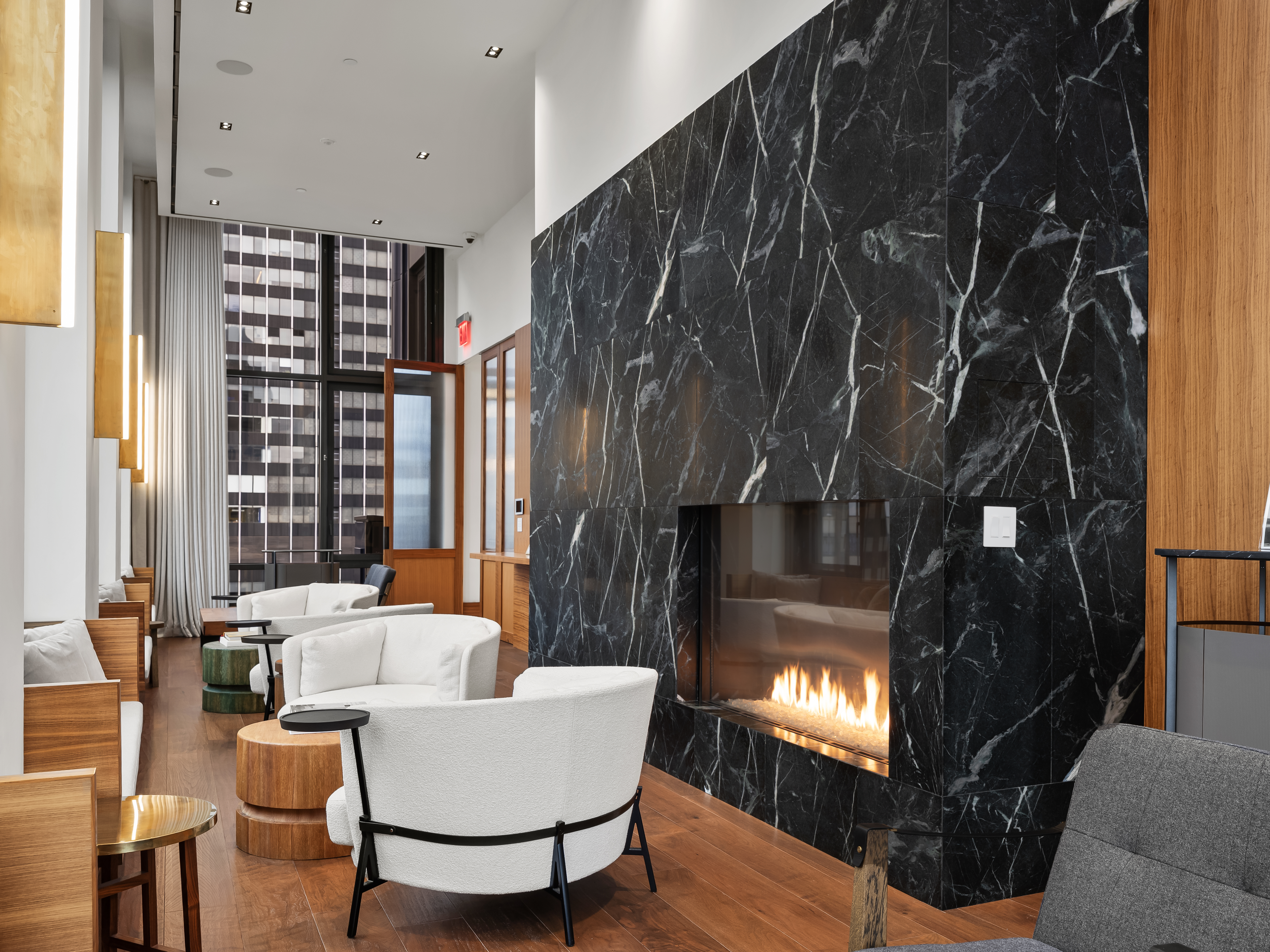 135 East 47th Street, Unit 4F Manhattan, NY 10017 - Photo 9 of 11 a living room with furniture and a fireplace