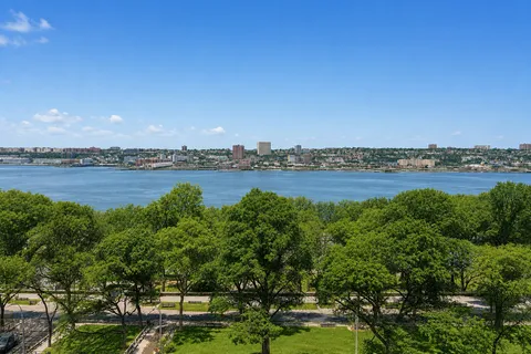 a view of an ocean and city