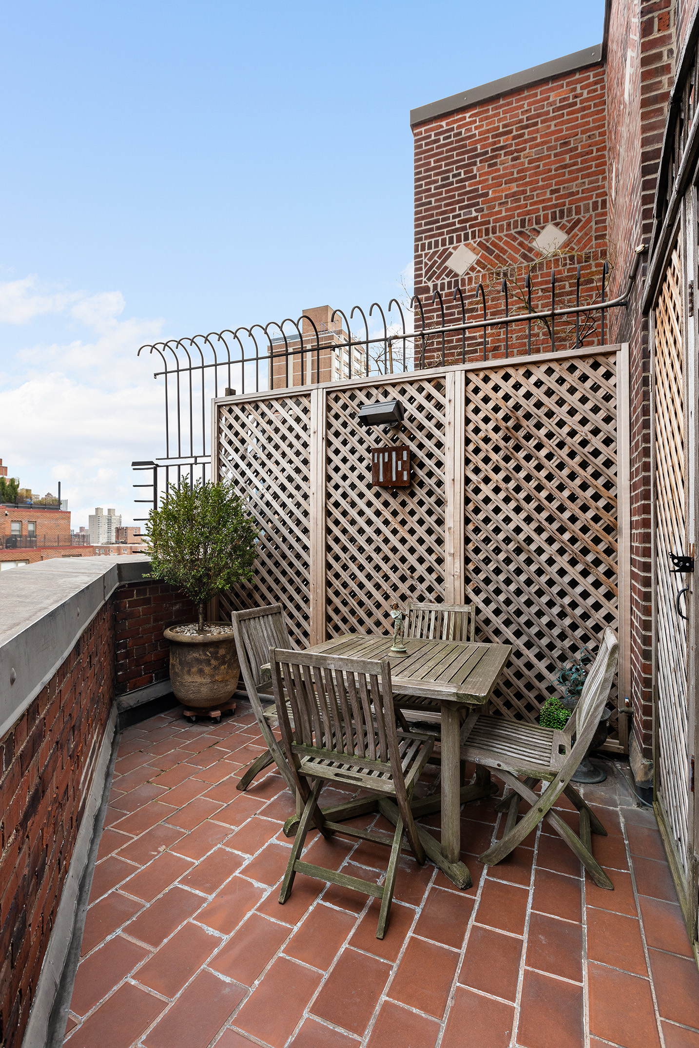 320 East 72nd Street, Unit PHB Manhattan, NY 10021 - Photo 17 of 26 a balcony with a bench and wooden floor
