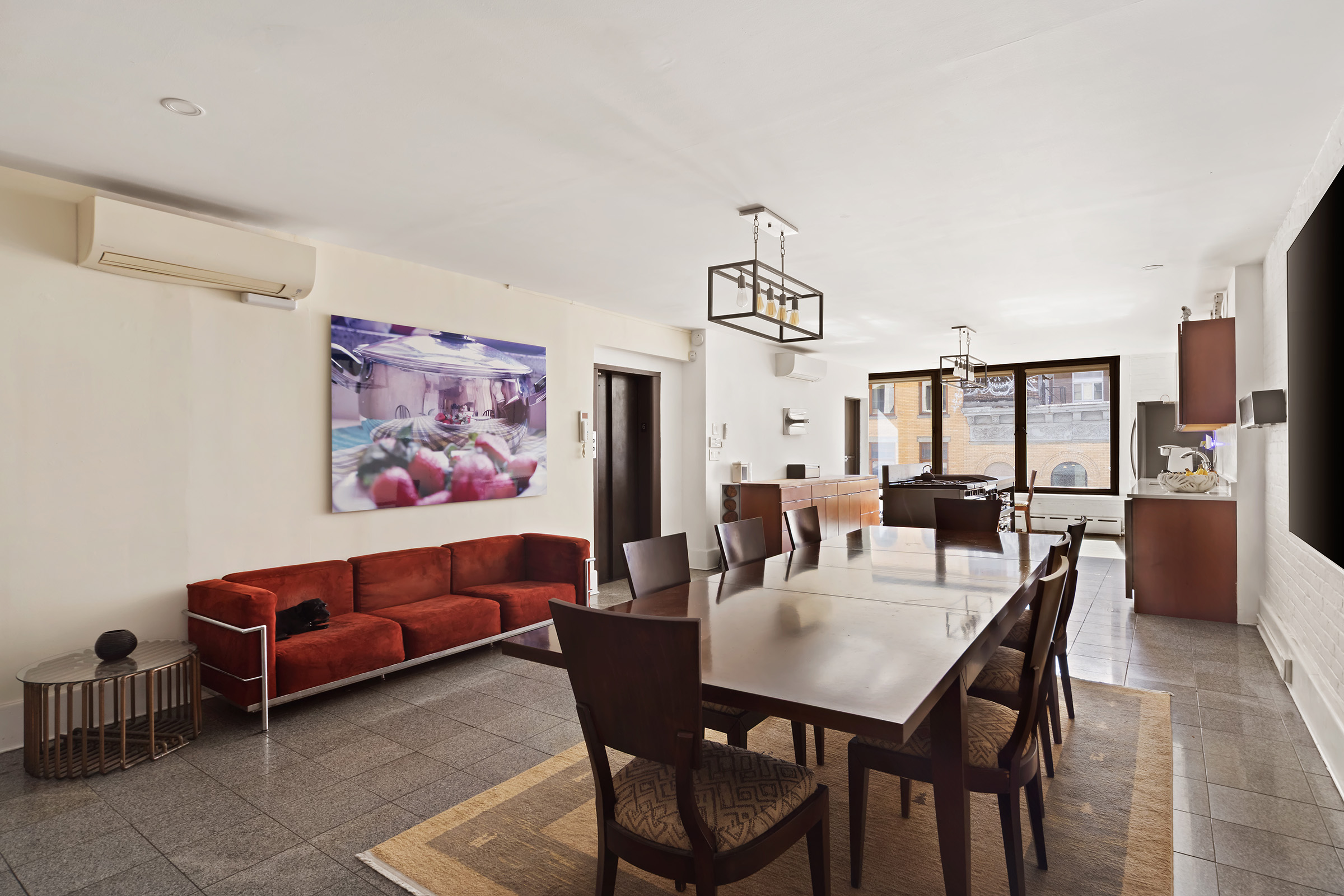 131 West 24th Street Manhattan, NY 10011 - Photo 9 of 16 a view of a dining room with furniture and window