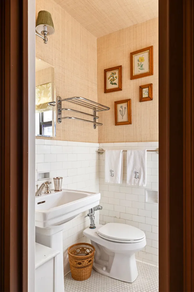 a bathroom with a toilet a sink and a window