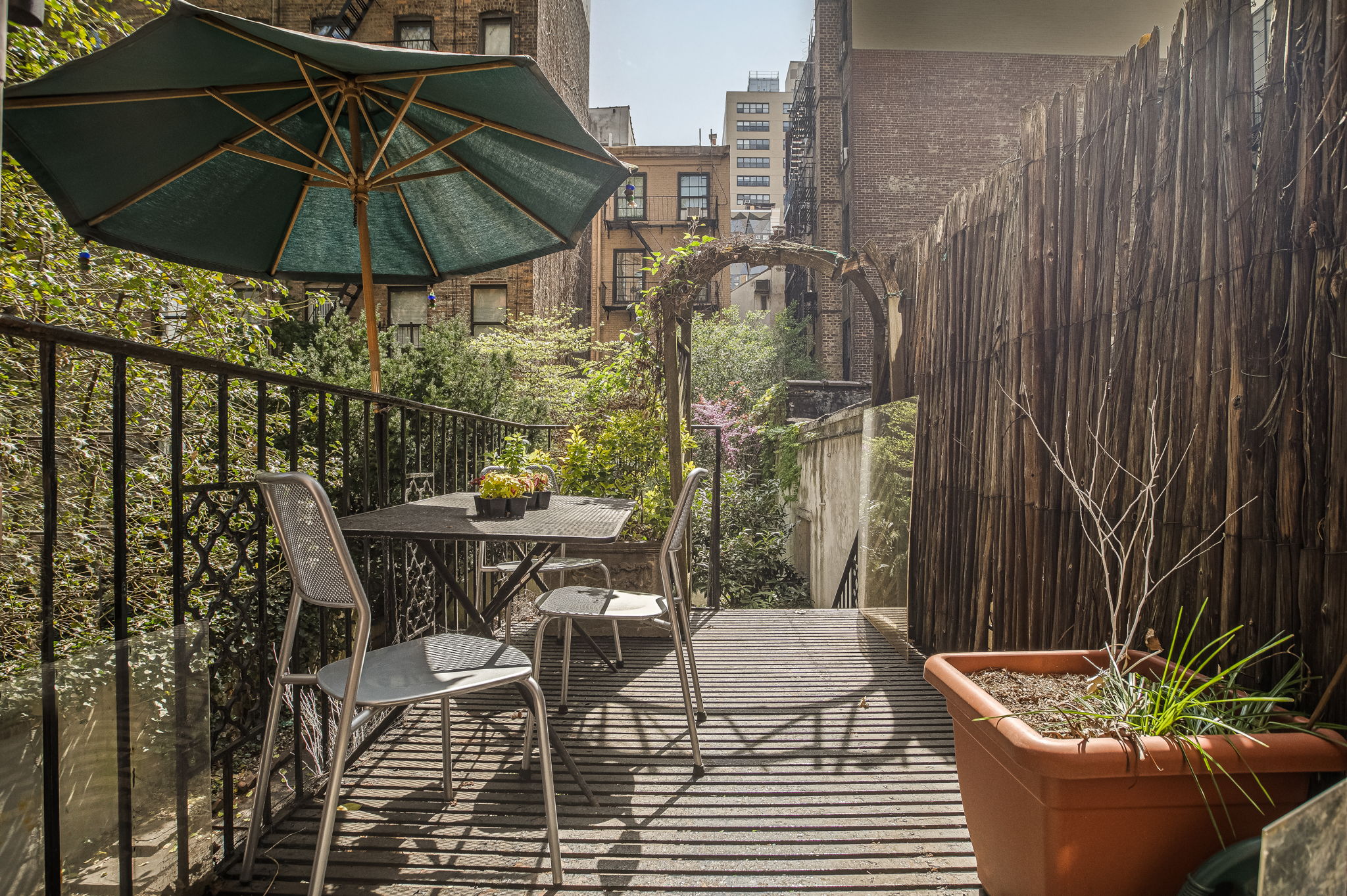 206 East 30th Street Manhattan, NY 10016 - Photo 17 of 21 a patio with a patio table and chairs