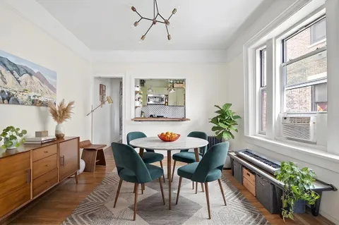 a view of a dining room with furniture window and outside view