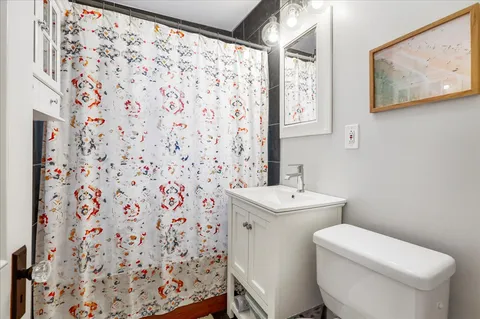 a bathroom with a toilet and sink