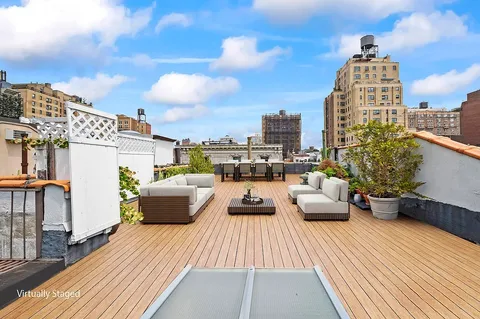 a view of roof deck with patio