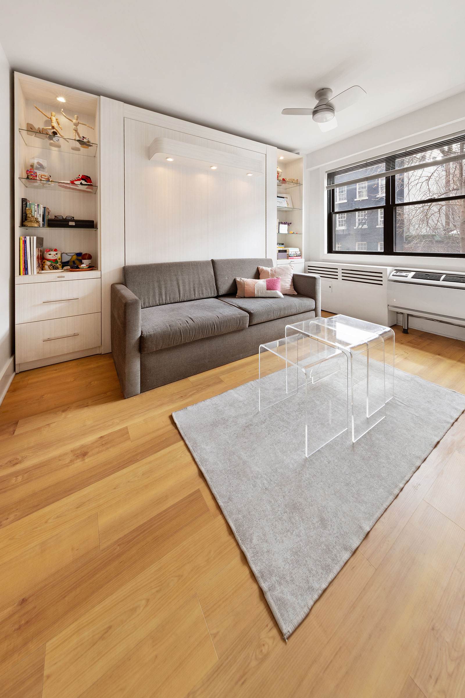 31 Jane Street, Unit 2CD Manhattan, NY 10014 - Photo 7 of 18 a living room with stainless steel appliances granite countertop furniture and a living room