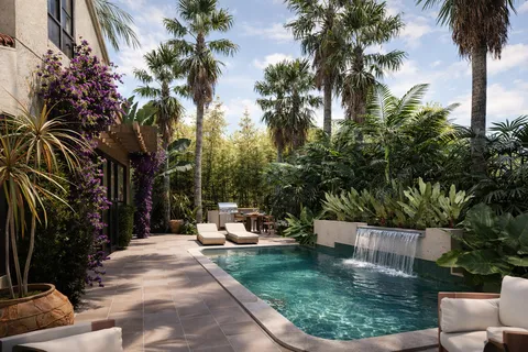 front view of a house with a yard chairs and a fire pit