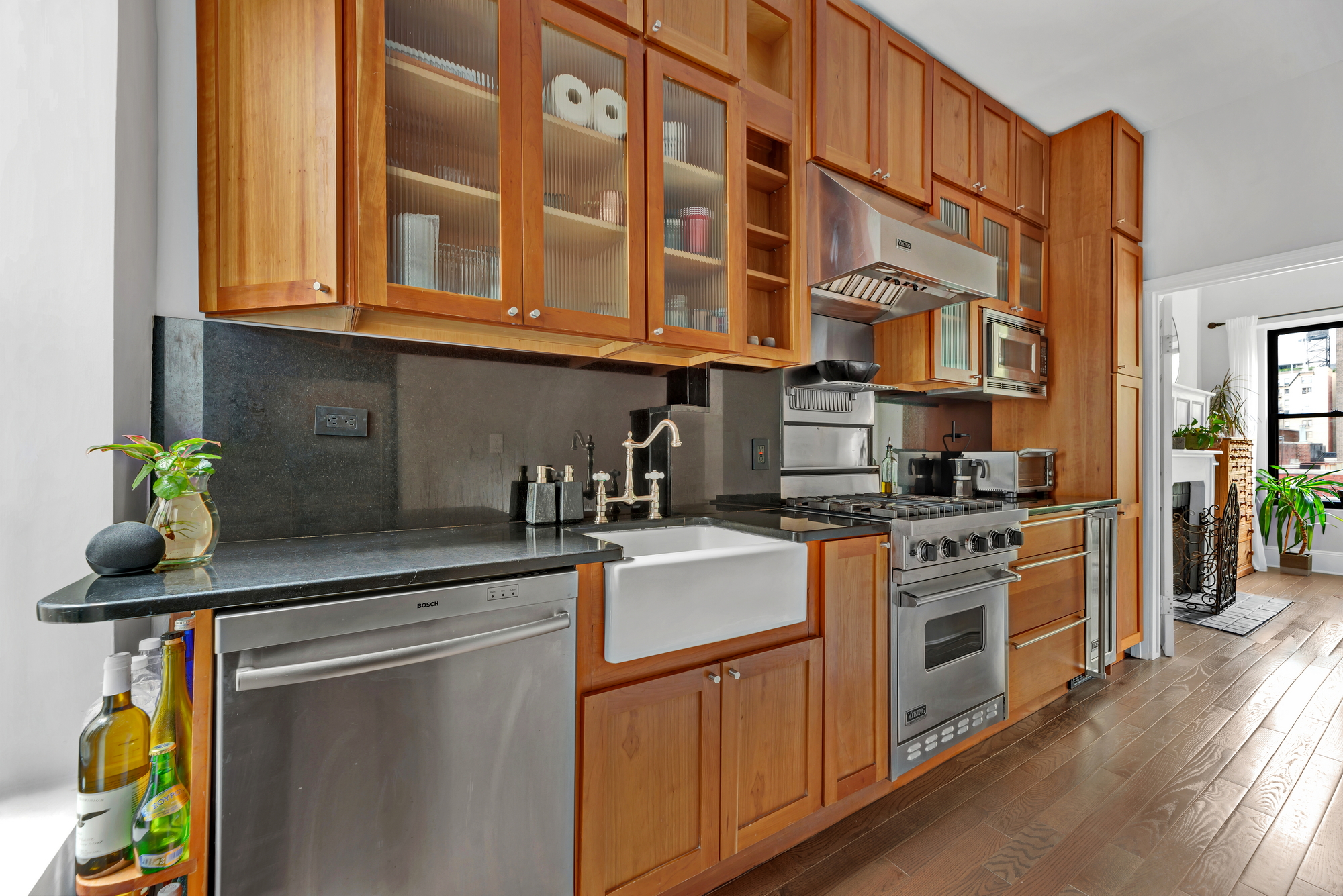 72 East 93rd Street, Unit 5AB Manhattan, NY 10128 - Photo 7 of 17 a kitchen with stainless steel appliances granite countertop a stove and a sink