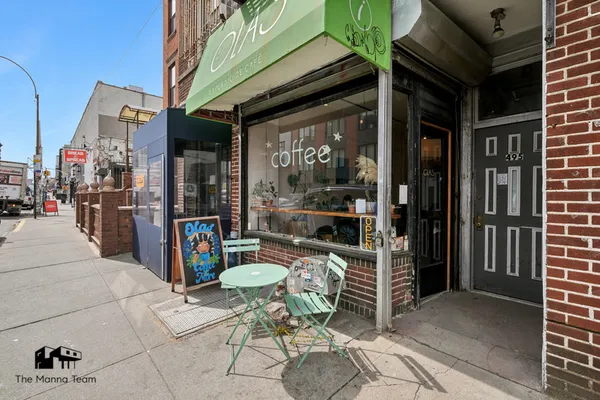 a view of a patio with table and chairs and potted plants