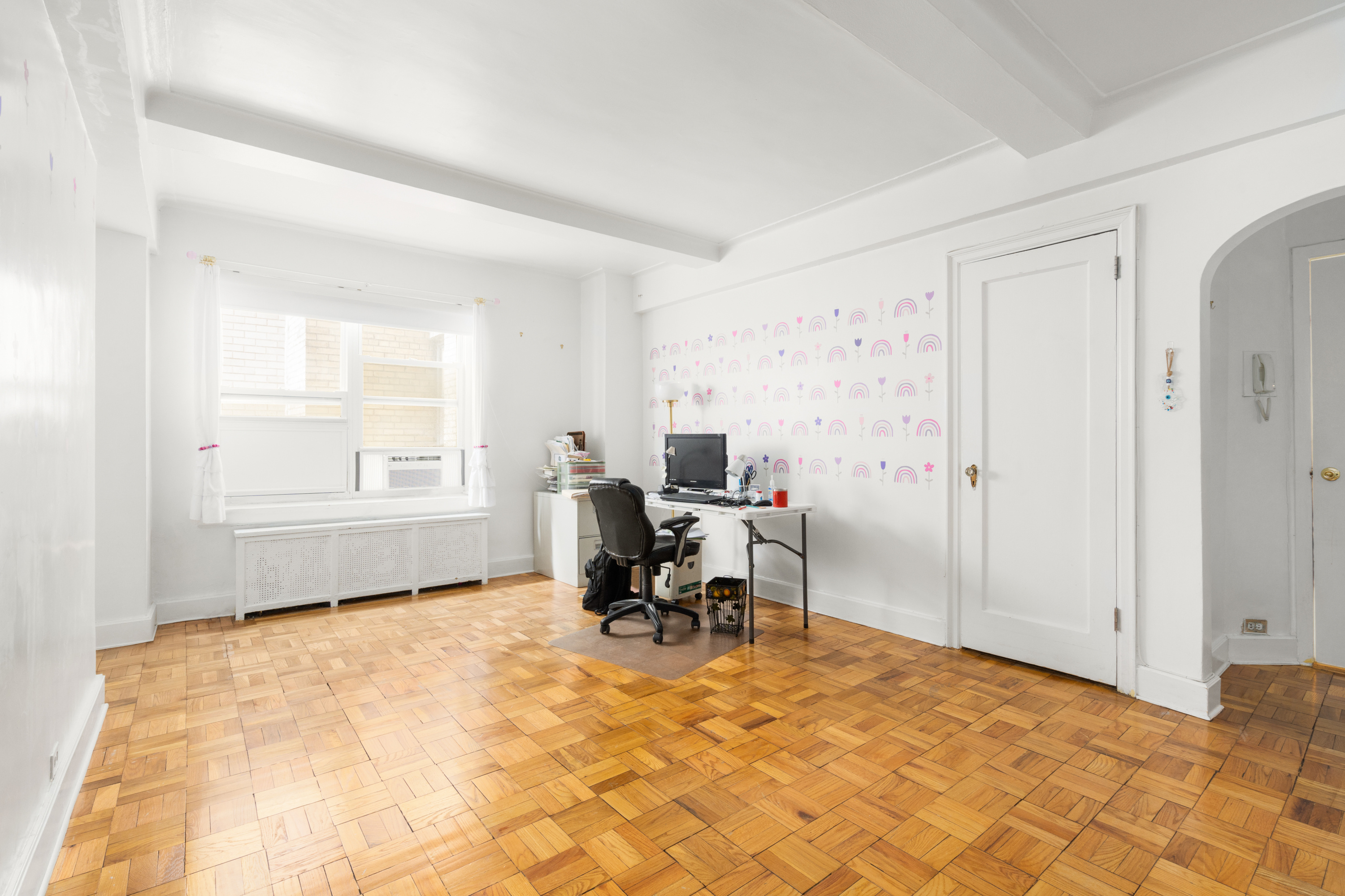 227 East 57th Street, Unit 3DEF Manhattan, NY 10022 - Photo 4 of 13 a workspace with furniture and a window