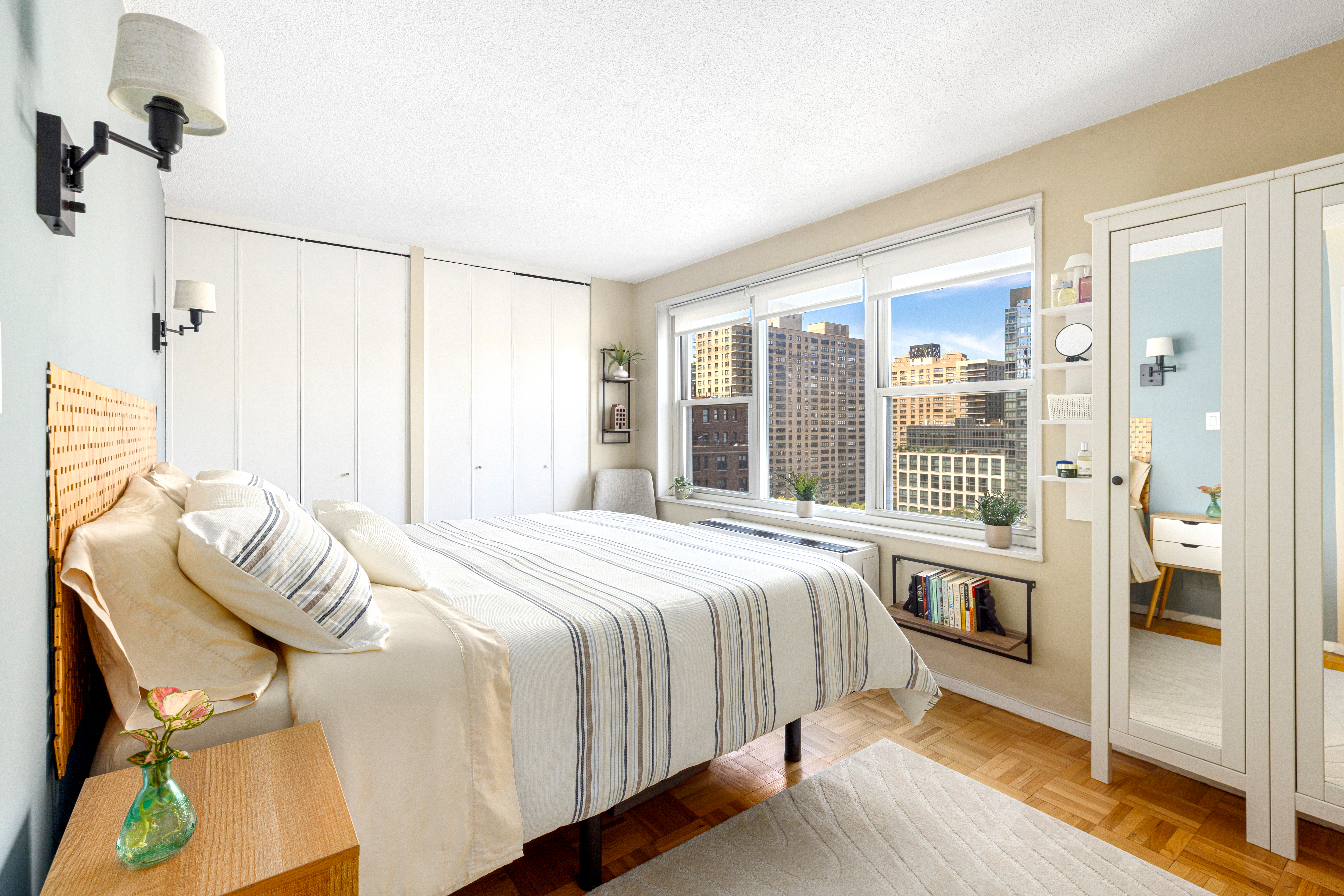 201 West 70th Street, Unit 17A Manhattan, NY 10023 - Photo 5 of 20 a bedroom with a bed and a window
