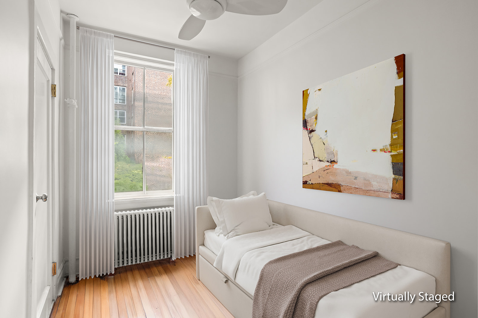 35-47 80th Street, Unit 2 Queens, NY 11372 - Photo 7 of 12 a bedroom with a bed and a window