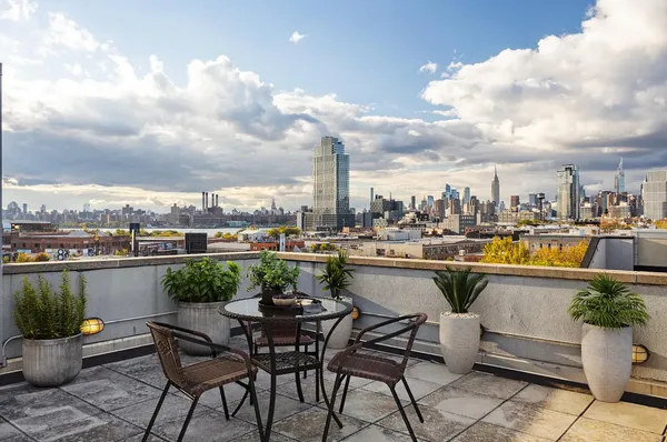 a view of a terrace with furniture