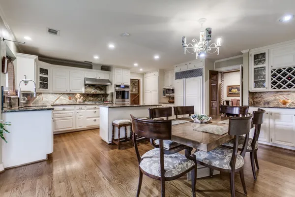 a bathroom with a toilet a sink and a mirror