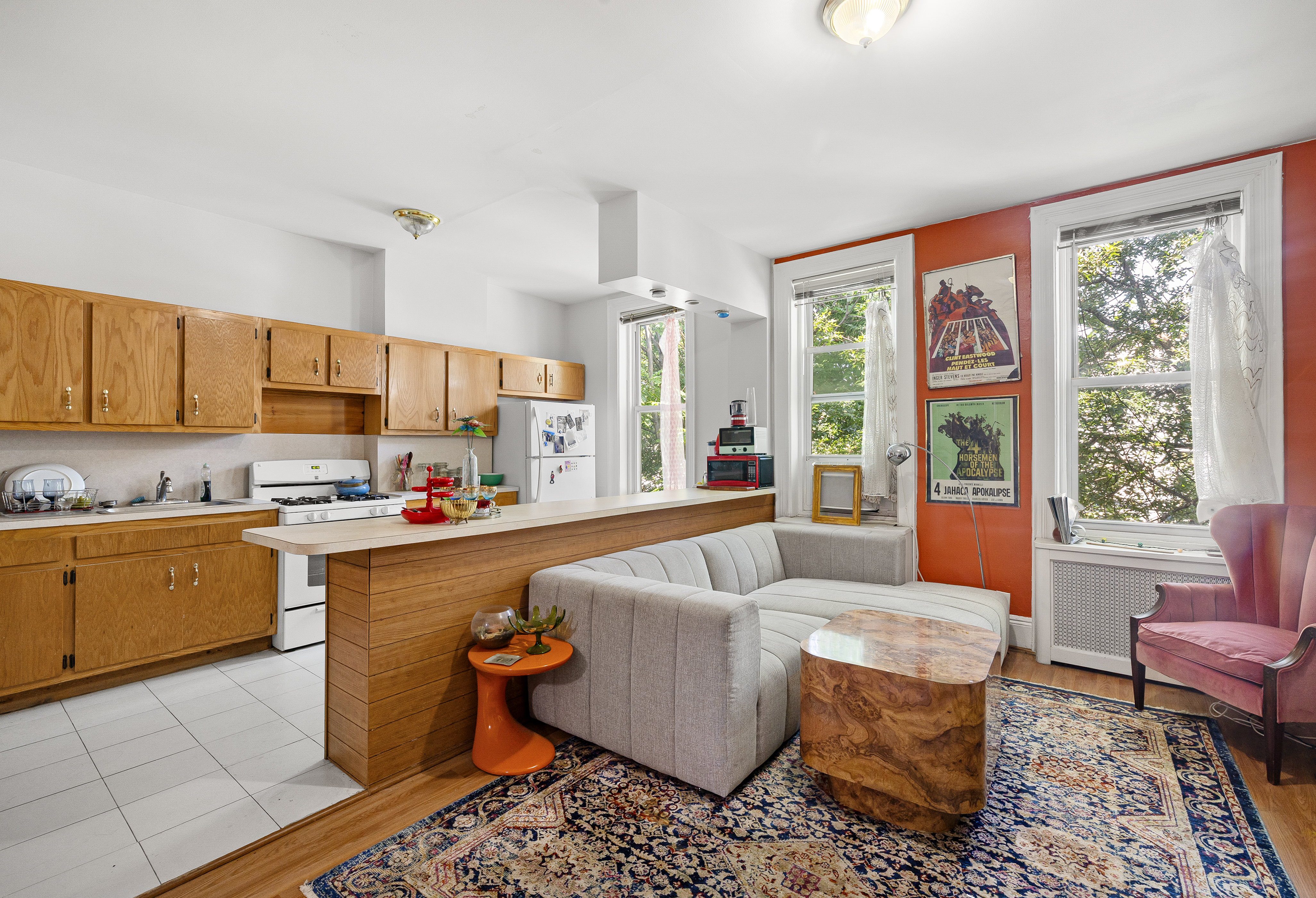59-47 Madison Street, Unit 2 Queens, NY 11385 - Photo 3 of 12 a living room with furniture and a large window