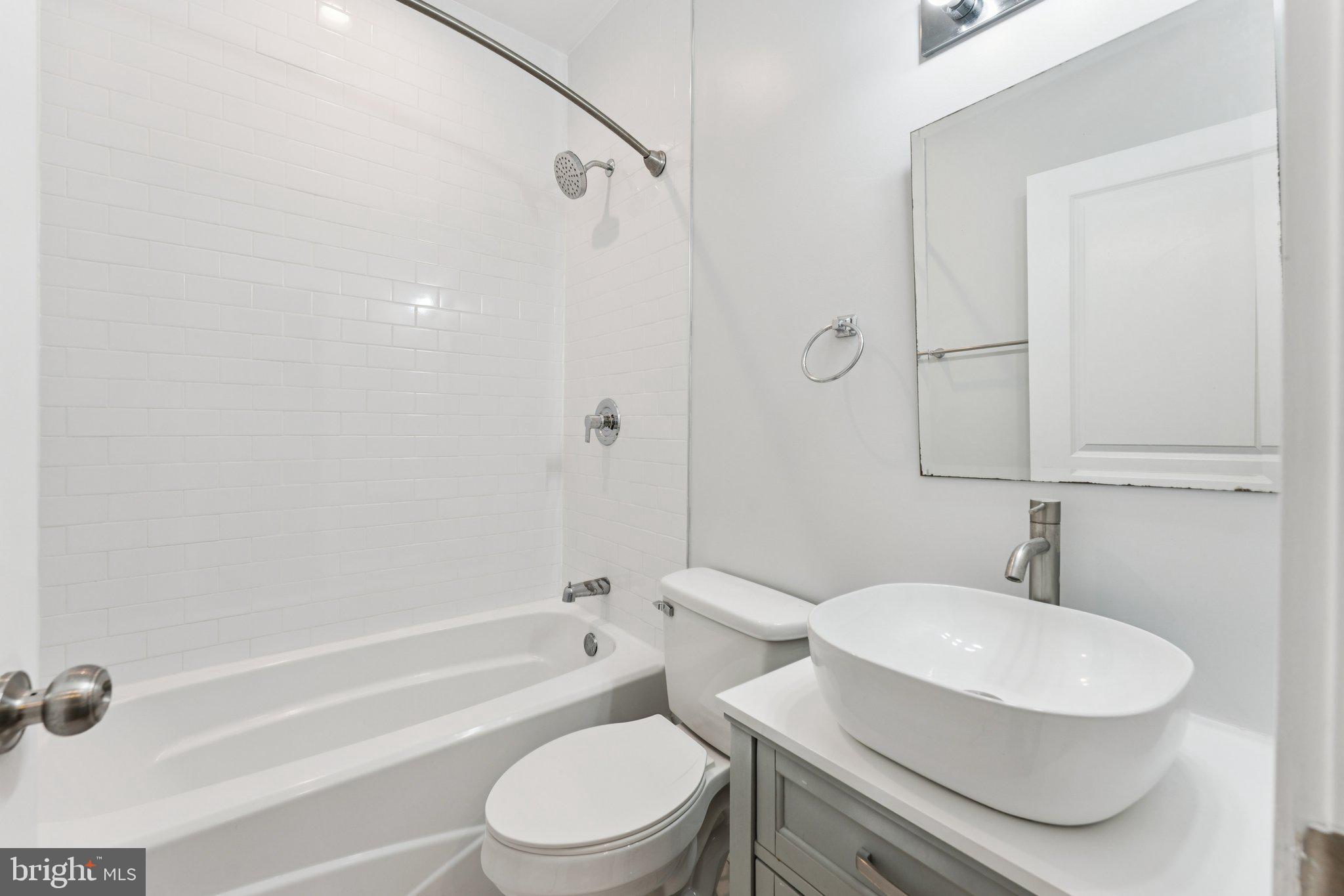 2822 28th Street Southeast Washington, DC 20020 - Photo 36 of 57 a bathroom with a toilet a sink and a bathtub