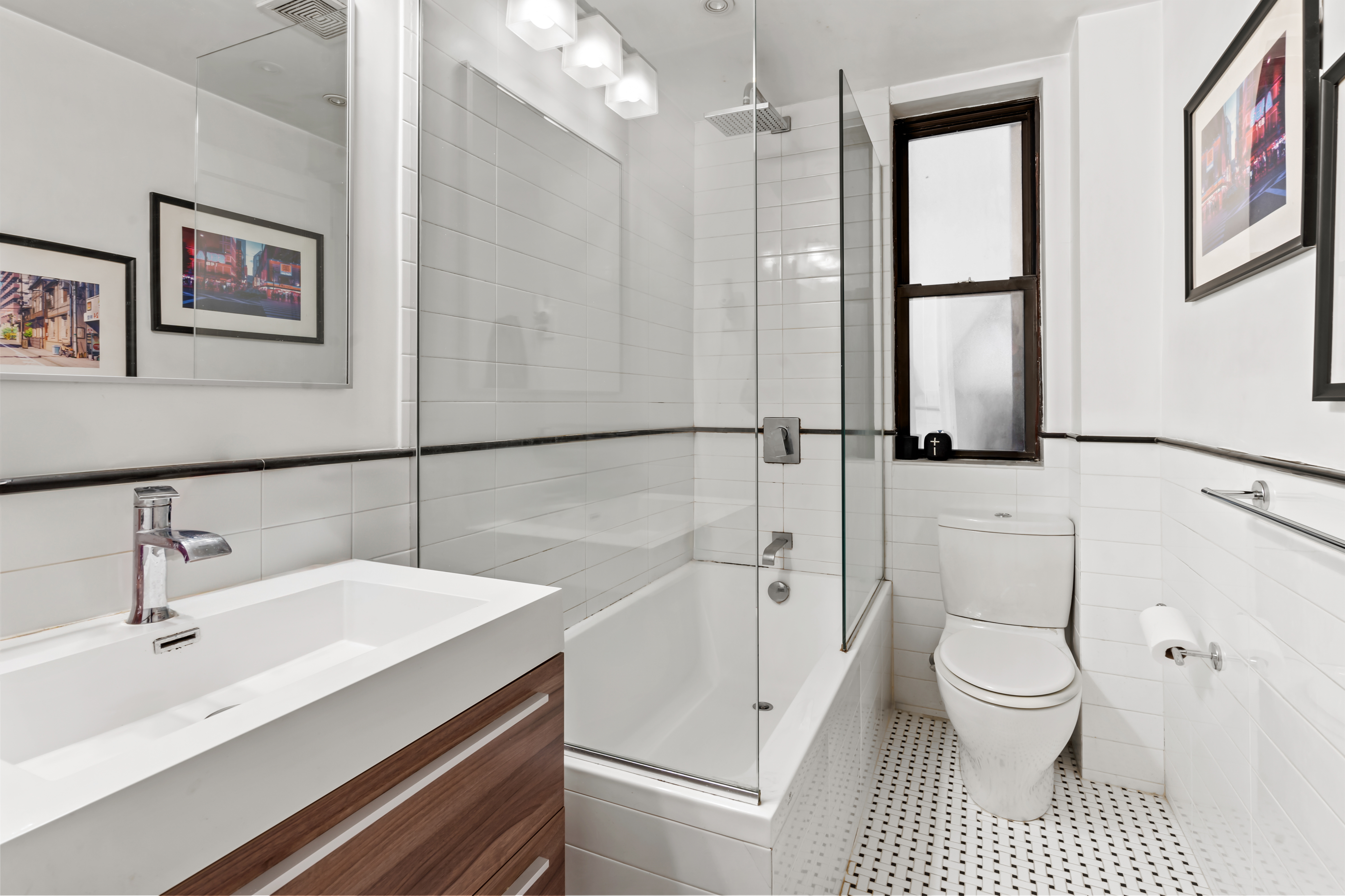 467 Central Park West, Unit 2G Manhattan, NY 10025 - Photo 5 of 10 a bathroom with a sink a toilet and a shower