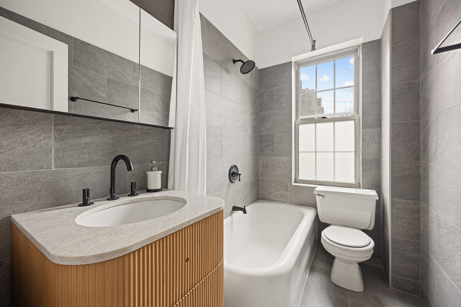 155 Henry Street, Unit 4H Brooklyn, NY 11201 - Photo 7 of 8 a bathroom with a toilet sink shower and mirror