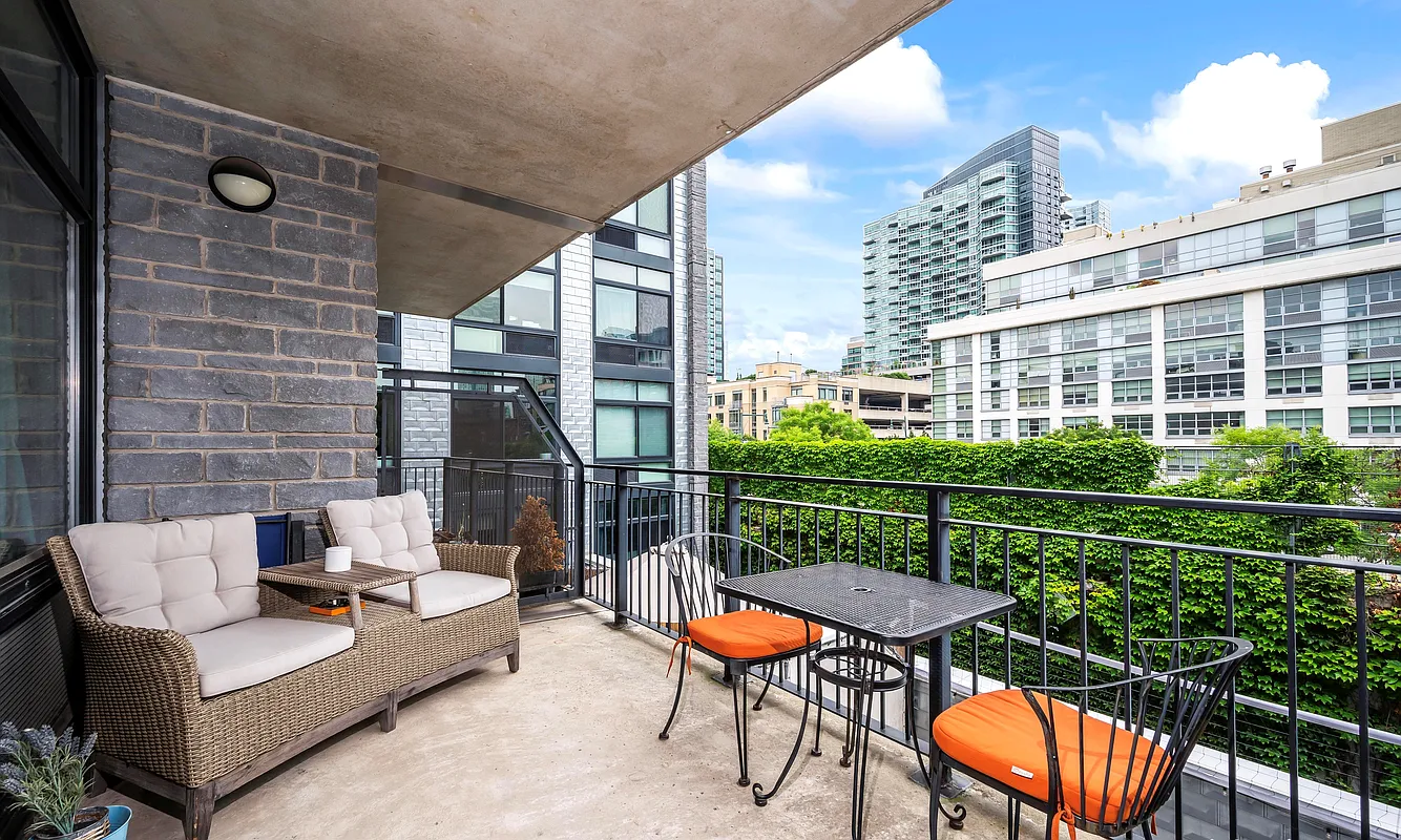 48-21 5th Street, Unit 3H Queens, NY 11101 - Photo 6 of 10 a view of a patio with a table chairs and a yard