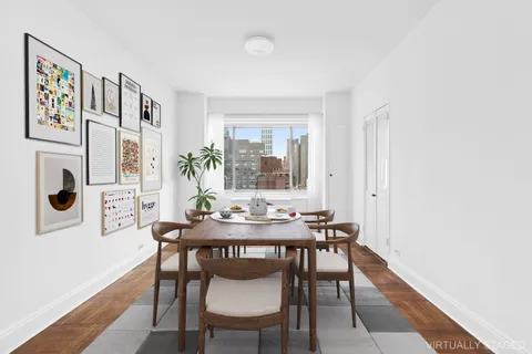 a dining room with furniture and window