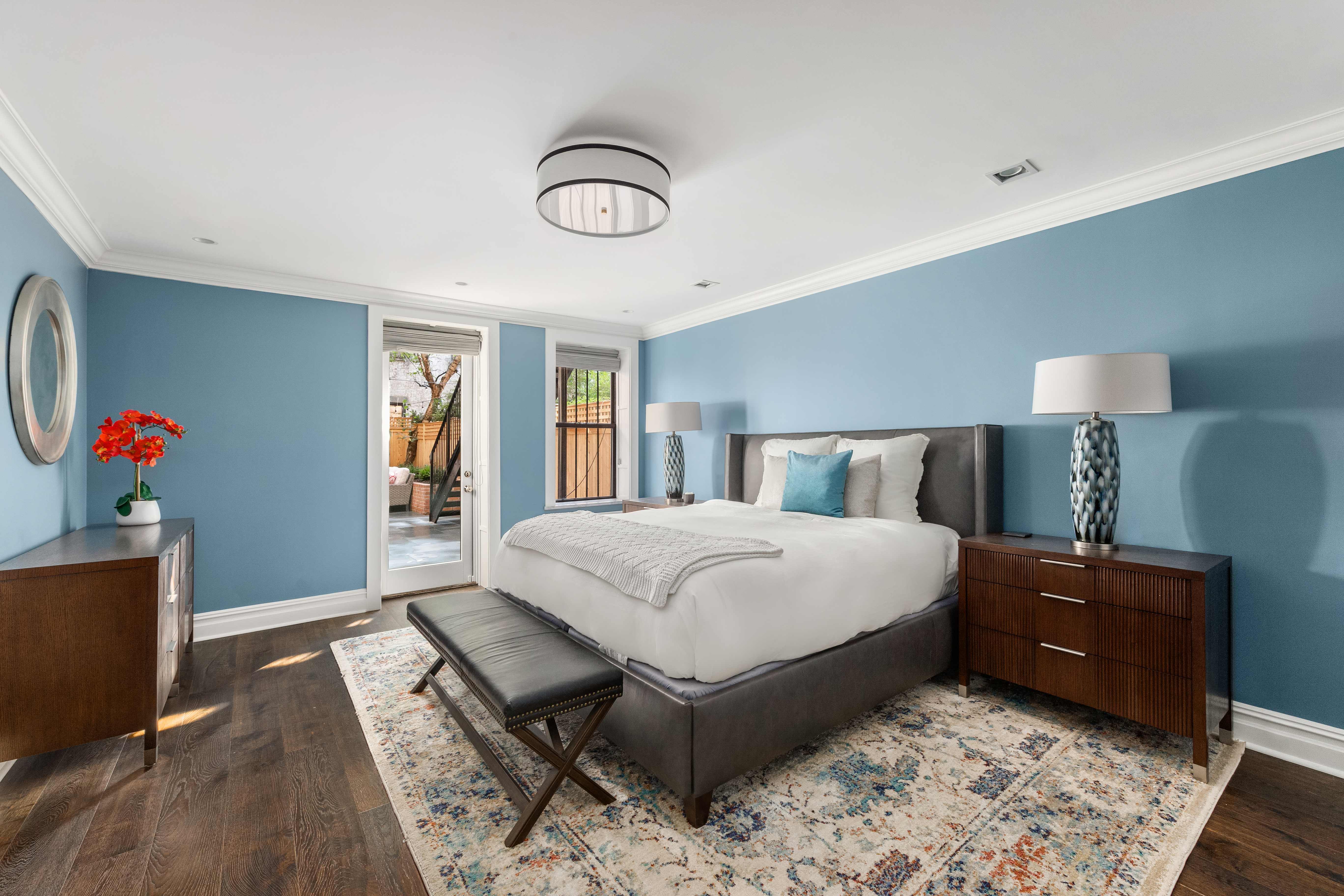 110 West 81st Street Manhattan, NY 10024 - Photo 8 of 30 a bedroom with a bed and a large mirror on dresser