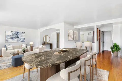 a living room with granite countertop furniture and fireplace